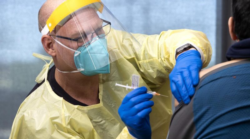 Squadron Leader Walter Goedde administers a COVID-19 vaccination to a member of the Orange community as a part of NSW Operation COVID-19 Assist. Story by Lieutenant Brendan Trembath. Photo by Corporal Dustin Anderson.