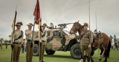 Members of the 10th Light Horse Regiment and the 10th Light Horse Memorial Troop stand in front of the regiments modern steed. Photo by Sergeant Gary Dixon.
