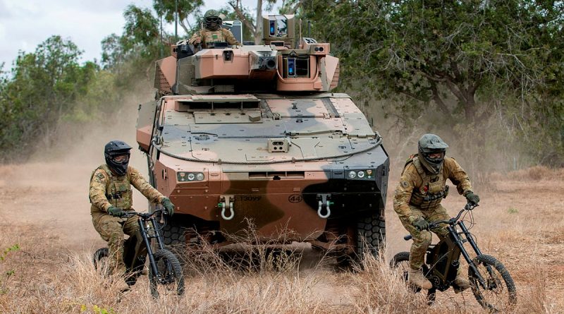 (left) Trooper Damian Day and Corporal Thomas Ovey from the 2nd/14th Light Horse Regiment (Queensland Mounted Infantry) conduct a scouting patrol on Australian Army Stealth Reconnaissance E-Bikes at Townsville Field Training Area, Queensland. Story by Captain Taylor Lynch. Photo by Corporal Nicole Dorrett.