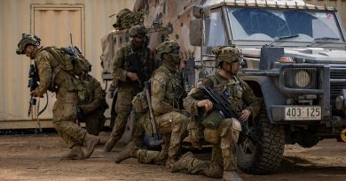 Soldiers from the 6th Battalion, Royal Australian Regiment, take cover behind an Australian Army G Wagon while conducting building clearances during urban operations training at Townsville Field Training Area, Queensland. Story by Captain Taylor Lynch. Photo by Corporal Nicole Dorrett.