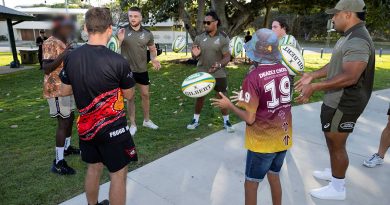 Players from the Wallabies Rugby team throw footballs with participants of the Proud Warrior Youth Engagement Program at Pallarenda Beach, Queensland on 23 September 2021. Story by Captain Lily Charles. Photo by Corporal Brandon Grey.