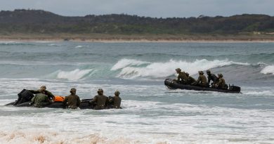 Trainees from the ADF School of Special Operations commando amphibious operations course practise their boat-handling and landing skills in Zodiac inflatable boats in the surf at Wanda Beach, Sydney, NSW. Photo by Able Seaman Benjamin Ricketts.