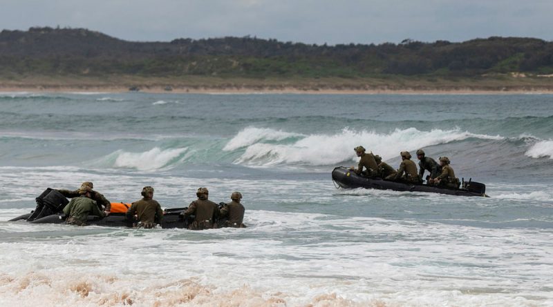 Trainees from the ADF School of Special Operations commando amphibious operations course practise their boat-handling and landing skills in Zodiac inflatable boats in the surf at Wanda Beach, Sydney, NSW. Photo by Able Seaman Benjamin Ricketts.