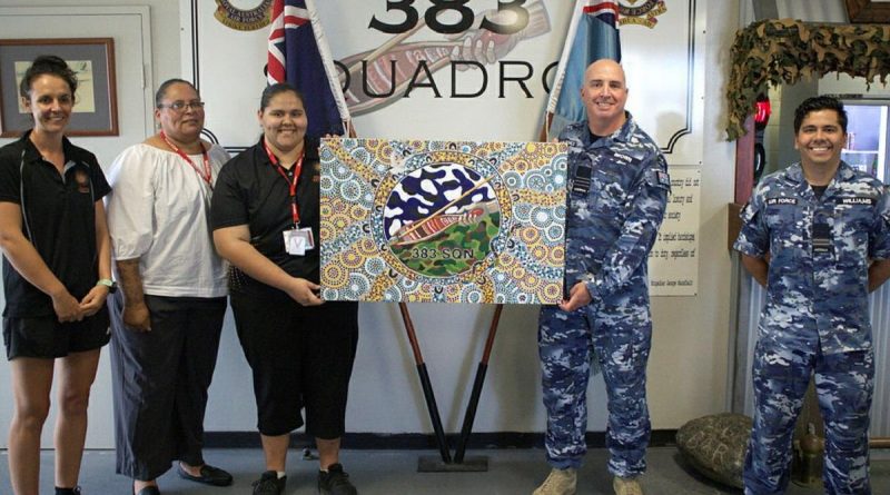 Commanding Officer No. 383 Squadron Wing Commander Alan Brown, centre right, and RAAF Base Townsville Indigenous liaison officer Flight Lieutenant David Williams with artist Kailin Kyle, centre, Stars Foundation's Emma Ferguson, left, and Jean Murphy. Story by Flying Officer Robert Hodgson.