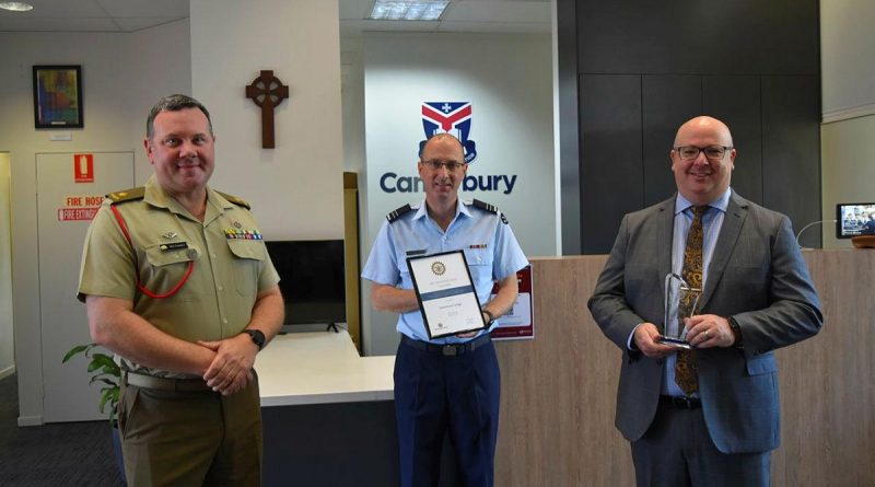 Major Ben Lanskey from Defence Reserves Support, left, Canterbury College's Flight Lieutenant Greg Wacker and Canterbury College principal Daniel Walker at the presentation of the Queensland Employer Support Award 2021. Story by Flight Lieutenant Nick O’Connor.