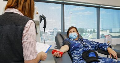 Enrolled nurse Nicole Gentry prepares Flight Sergeant Kate Morris, of No. 295 Squadron, for her plasma donation at the Red Cross Ipswich Donation Centre in Queensland. Story by Flight Lieutenant Jessica Aldred. Photo by Corporal Nicci Freeman.