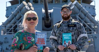 Owner of My Little Bookshop Kerry Ridley with Leading Seaman James McPhail on board HMAS Warramunga at Fleet Base West. Story by Lieutenant Geoff Lon. Photo by Petty Officer Yuri Ramsey.