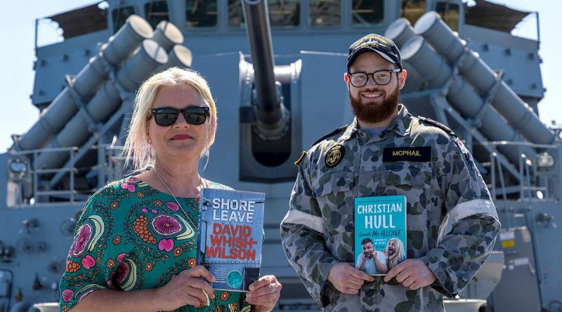 Owner of My Little Bookshop Kerry Ridley with Leading Seaman James McPhail on board HMAS Warramunga at Fleet Base West. Story by Lieutenant Geoff Lon. Photo by Petty Officer Yuri Ramsey.