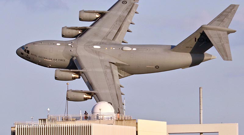 A C-17A Globemaster III from No. 36 Squadron at RAAF Base Amberley, conducts a low-level flight over the Brisbane CBD during Sunsuper Riverfire. Photo by CONTACT stringer Christabel Migliorini.