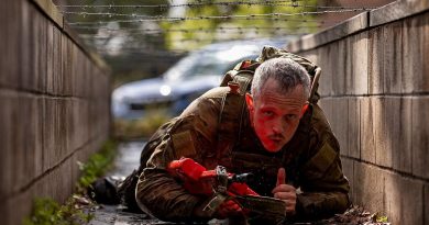 A soldier from the 7th Combat Brigade crawls under barbed wire during the 7th Combat Brigade Commander's Cup obstacle course competition at Gallipoli Barracks, Brisbane. Story b y Captain Taylor Lynch. Photo by Corporal Nicole Dorrett.