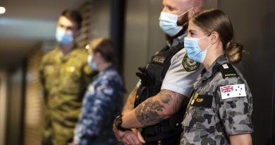NSW Police Senior Constable Peter Heginbotham, front left, and Midshipman Bridie Kemp on hotel quarantine duties during Operation COVID-19 Assist. Story by Flight Lieutenant Eamon Hamilton. Photo by Corporal Dustin Anderson.