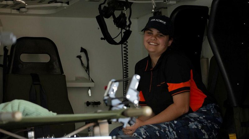 Indigenous Youth Program student Andrea Cole in a No. 1 Expeditionary Health Squadron Bushmaster ambulance during a visit to RAAF Base Townsville. Story by Flying Officer Veronika Koroleva. Photo by Leading Aircraftwoman Annalin Wright.
