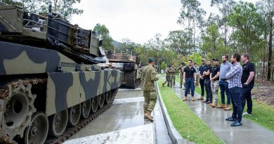A group of civilians who bid for an Army experience in a charity auction supporting Legacy are given details about the M1A1 Abrams main battle tank at Gallipoli Barracks. Story by Captain Michael Trainor. Photo by Corporal Kerry Uilderks.