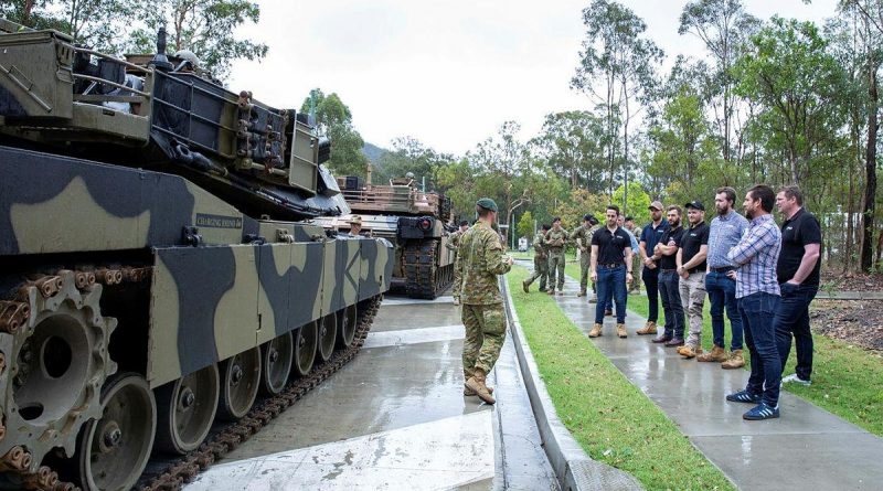 A group of civilians who bid for an Army experience in a charity auction supporting Legacy are given details about the M1A1 Abrams main battle tank at Gallipoli Barracks. Story by Captain Michael Trainor. Photo by Corporal Kerry Uilderks.