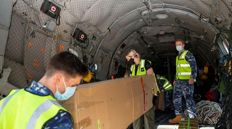 Air movements operators from No. 23 Squadron and loadmasters from No. 35 Squadron load engineering equipment bound for Fiji onto an Air Force C-27J Spartan at RAAF Base Amberley. Story by Flying Officer Robert Hodgson. Photo by Leading Aircraftwoman Emma Schwenke.