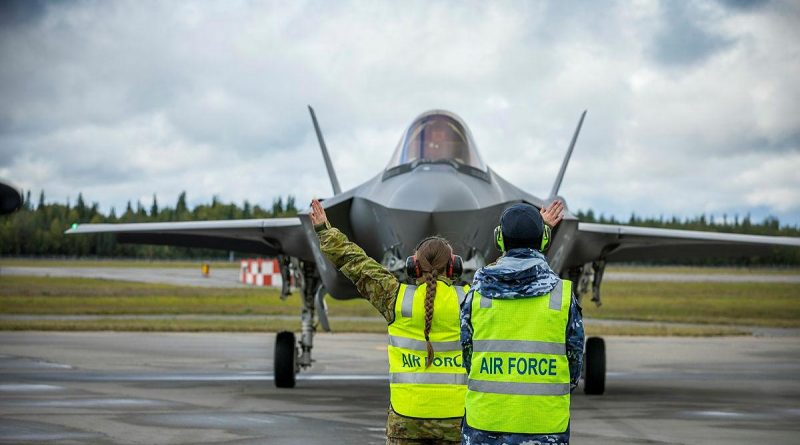 Leading Aircraftman Paul Taylor supervises Aircraftwoman Milena Frolova from No. 3 Security Forces while marshalling an F-35A Lightning II from No. 3 Squadron at Eielson Air Force Base in Alaska, United States. Story and photo by Flying Officer Bronwyn Marchant.