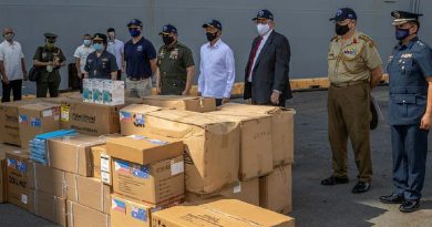 Personnel from HMAS Canberra deliver personal protective equipment to Manila, Philippines, during Indo-Pacific Endeavour 2021. Story by Captain Peter March. Photo by Petty Officer Christopher Szumlanski.