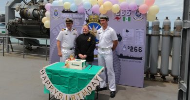 Commanding Officer HMAS Sirius Commander Chris Doherty, left, Leading Seaman Esler Cartledge and Seaman Leroy O’Connor celebrate the ship's 15th birthday. Story by Lieutenant Ryan Svensson.
