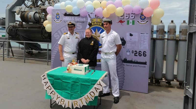 Commanding Officer HMAS Sirius Commander Chris Doherty, left, Leading Seaman Esler Cartledge and Seaman Leroy O’Connor celebrate the ship's 15th birthday. Story by Lieutenant Ryan Svensson.