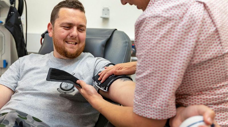 Leading Seaman Benjamin Jenkins, of HMAS Stirling, prepares to make a blood donation at the Rockingham Red Cross Lifeblood Centre, Western Australia. Story by Lieutenant Nancy Cotton. Photo by Leading Seaman Ronnie Baltoft.