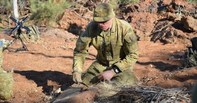Corporal Andrew Ball demonstrates lighting a fire with a fero rod on Exercise Emu Walk. Story by Captain Sandra Seman-Bourke.