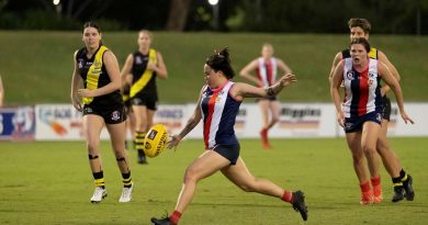 Corporal Rhian Mears, of 3rd Brigade Headquarters, plays for the Curra Swans Australian Rules football team during their grand final win in Townsville. Story by Captain Diana Jennings. Photo by Corporal Brodie Cross.