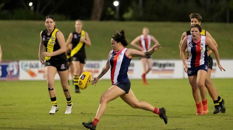 Corporal Rhian Mears, of 3rd Brigade Headquarters, plays for the Curra Swans Australian Rules football team during their grand final win in Townsville. Story by Captain Diana Jennings. Photo by Corporal Brodie Cross.