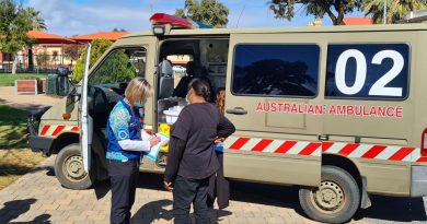Pika Wiya registered nurse Rebecca Simpson conducts a pre-assessment in the Port Augusta town centre before a local receives their COVID-19 vaccination out of the ADF ambulance. Story by Captain Thomas Kaye.