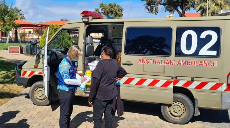 Pika Wiya registered nurse Rebecca Simpson conducts a pre-assessment in the Port Augusta town centre before a local receives their COVID-19 vaccination out of the ADF ambulance. Story by Captain Thomas Kaye.