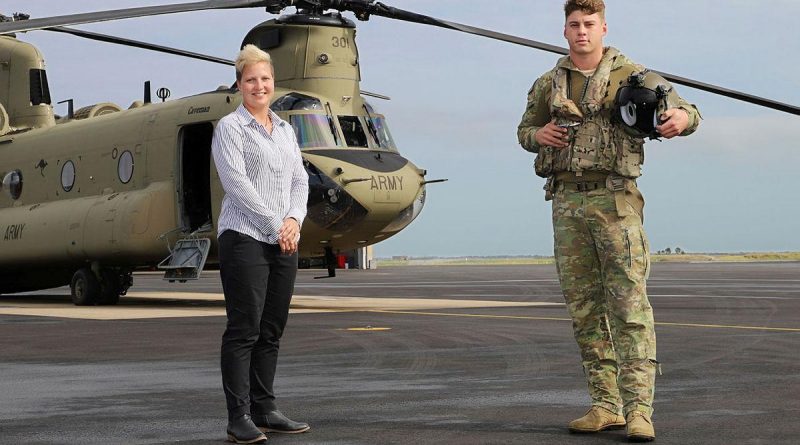 Townsville Defence Weather Service Office manager Krystelle Venn with 5th Aviation Regiment's Lieutenant David Selvage at RAAF Base Garbutt, Queensland. Photo by Lance Corporal Lisa Sherman.