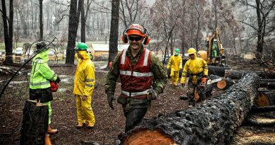 Sapper Zakary Lamrock, of the 5th Combat Engineer Regiment, and Indonesian National Armed Forces troops clear at the Zig Zag Railway, Lithgow, during Operation Bushfire Assist in February last year. Photo by Flight Sergeant Ricky Fuller.