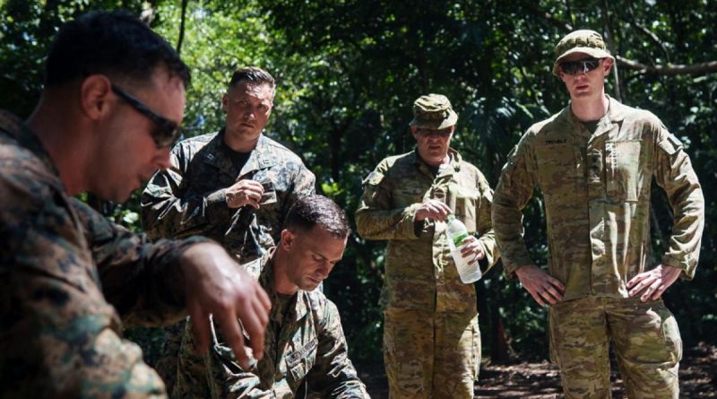 Army Sergeant Paul Waples is shown unexploded demolition techniques by United States Marine Corps 1st Lieutenant Molly Mcgrath while observing Task Force Koa Moana in Palau. Story by Captain Michael Trainor.