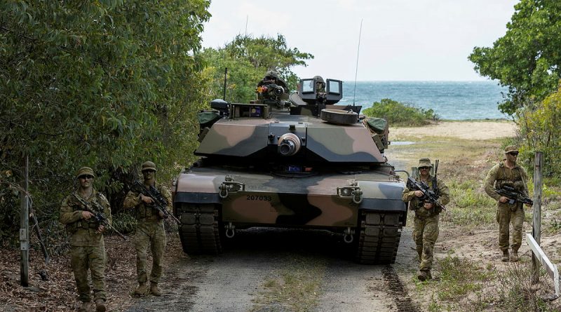 Australian Army soldiers from the 1st Battalion, The Royal Australian Regiment and the 2nd Cavalry Regiment, patrol a track during the combined arms training activity at Cowley Beach Training Area, Queensland. Story by Captain Diana Jennings. Photo by Corporal Bodie Cross.