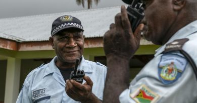 Vanuatu Police Force Inspector Paul Thompson (right) and Sergeant Willie Daniel Obed test their handheld radios at the Tongoa Island Police Post during the Vanuatu Government National Emergency Radio Network project. Story by Captain Taylor Lynch. Photo by Corporal Kieren Whiteley.