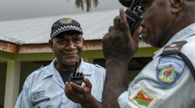 Vanuatu Police Force Inspector Paul Thompson (right) and Sergeant Willie Daniel Obed test their handheld radios at the Tongoa Island Police Post during the Vanuatu Government National Emergency Radio Network project. Story by Captain Taylor Lynch. Photo by Corporal Kieren Whiteley.