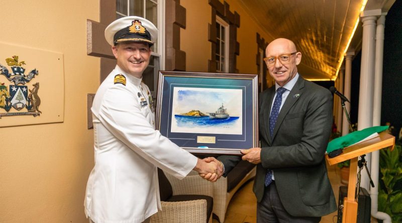 Commander Christopher Doherty presents the painting to the Administrator of Norfolk Island, Eric Hutchinson. Story by Lieutenant Jessica Craig. Photo by LSIS Sittichai Sakonpoonpol.