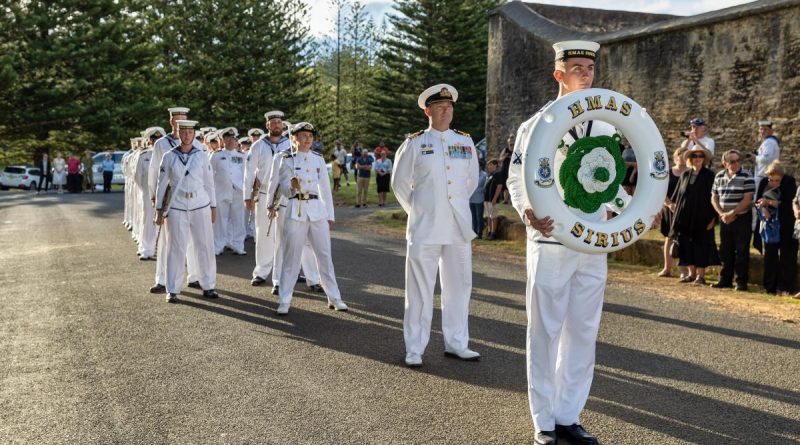 The ship's company of HMAS Sirius stands ready to step off for a march through the streets of Norfolk Island as part of a final visit to the ship's ceremonial home port. Story by Lieutenant Jessica Craig. Photo by Leading Seaman Sittichai Sakonpoonpol.