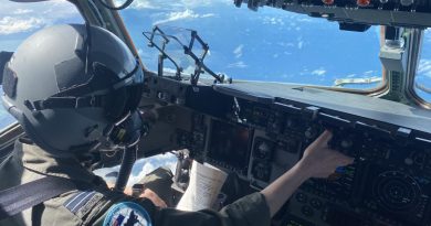 A RAAF pilot with No. 36 Squadron in the cockpit of a C-17A Globemaster during Exercise Global Dexterity 21. The helmet and oxygen mask are worn when performing airdrops. Story by Eamon Hamilton. Photo by Flight Lieutenant Matt Huber.