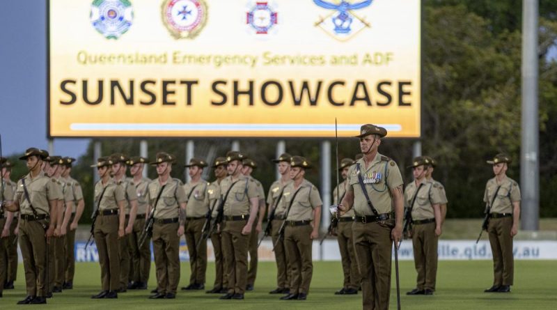 Soldiers and officers from the 1st Battalion, The Royal Australian Regiment on parade during the Queensland Emergency Services and ADF Sunset Showcase at Riverway Stadium, Townsville. Story by Captain Diana Jennings. Photo by Corporal Brandon Grey.