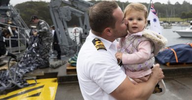 Commanding Officer HMAS Gascoyne, Lieutenant Commander Geoff Crane kisses is daughter on the wharf at HMAS Waterhen following his return home after the completion of a successful deployment. Story by Lieutenant Jessica Craig. Photo by Petty Officer Tom Gibson.