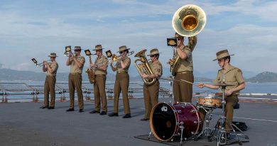 The Australian Army Band perform as HMAS Canberra comes alongside in Cam Ranh Bay, Vietnam, during a contactless port visit as part of Indo-Pacific Endeavour 2021. Story by Captain Peter March. Photo by Leading Seaman Nadav Harel.