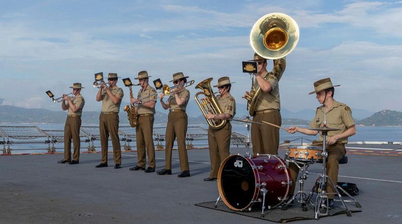 The Australian Army Band perform as HMAS Canberra comes alongside in Cam Ranh Bay, Vietnam, during a contactless port visit as part of Indo-Pacific Endeavour 2021. Story by Captain Peter March. Photo by Leading Seaman Nadav Harel.
