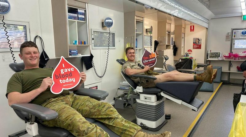 Corporal Aaron Hopgood, left, and Lance Corporal Matthew Bosman, of the 16th Regiment, Royal Australian Artillery, relax after donating blood at an Australian Red Cross Lifeblood mobile donor centre at Woodside Barracks, South Australia. Story by Captain Evita Ryan.