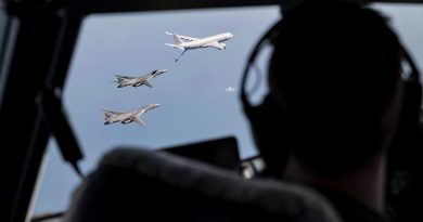 A Royal Australian Air Force KC-30A Multi Role Tanker Transport aircraft and two United States Air Force B-1B Lancer bombers fly in formation over the Northern Territory, watched by the crew of another RAAF MRTT. Photo by Flight Lieutenant Byron Miles-Ward.