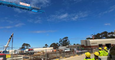 Students from Puckapunyal Primary School watch on as 'Carla the Crane' is erected at the Stage 1 – Armoured Fighting Vehicle Facilities Program project site at the School of Armour. Story by Major Carrie Robards.