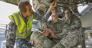 Leading Aircraftman Aaron Kouyoumtzoglou and Staff Sergeant Dustin Sheffield lock wire a fuel filter during the Enhanced Air Cooperation third phase as part of Exercise Pacific Agility. Photo by Corporal Brenton Kwaterski.