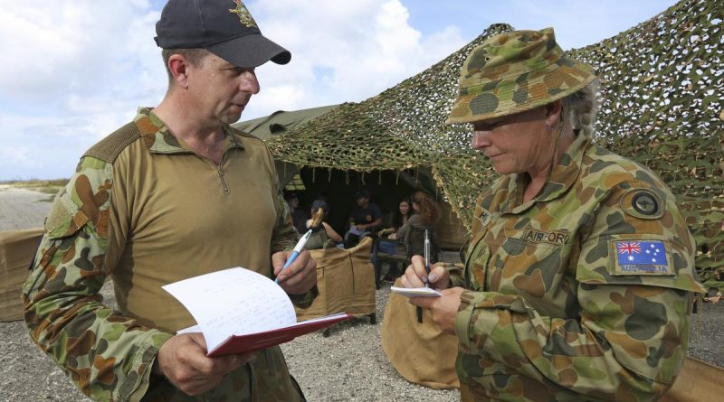 Royal Australian Air Force gender adviser Flight Sergeant Dean Maher provides guidance and advice to Sergeant Rebecca Hass on gender in military operations, as part of Exercise Cope North 19, Baker Airfield, Tinian Island. Story by Leading Seaman Kylie Jagiello. Photo by Sergeant Kirk Peacock.