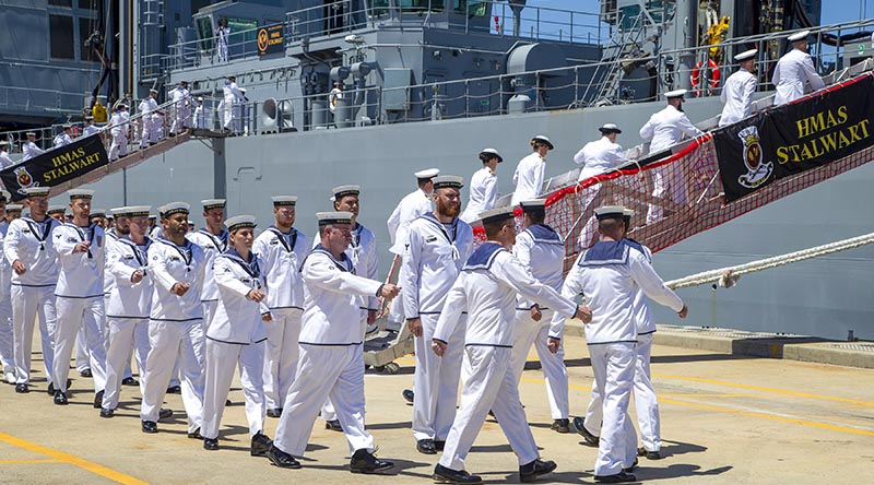 HMAS Stalwart's Ship's Company "crew ship" for the first time during a commissioning ceremony for the auxiliary oiler replenishment at Fleet Base West, Rockingham, WA. Photo by Leading Seaman Ernesto Sanchez.