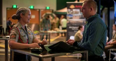 Warrant Officer Class Two Charlotte Hansen, left, of the 20th Regiment, Royal Australian Artillery, talks to Private Zach Holmes, of the 9th Battalion, Royal Queensland Regiment, at the jobs expo in Brisbane. Story by Captain Jesse Robilliard. Photo by Private Jacob Hilton.