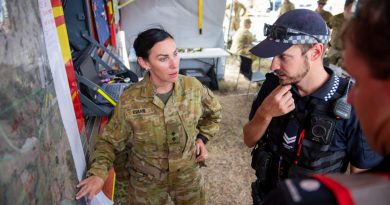 Lieutenant Misty Evans, of the 31st/42nd Battalion, Royal Queensland Regiment, briefs Queensland Polica and Queensland Fire and Emergency Service personnel on ADF search activity. Story by Private Jacob Joseph. Photo by Warrant Officer Class 2 Neil Ruskin.